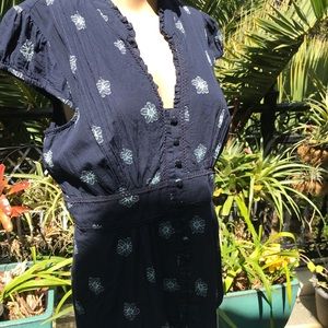 Adorable Odille Navy blue blouse with white pops of flowers. Vintage look.